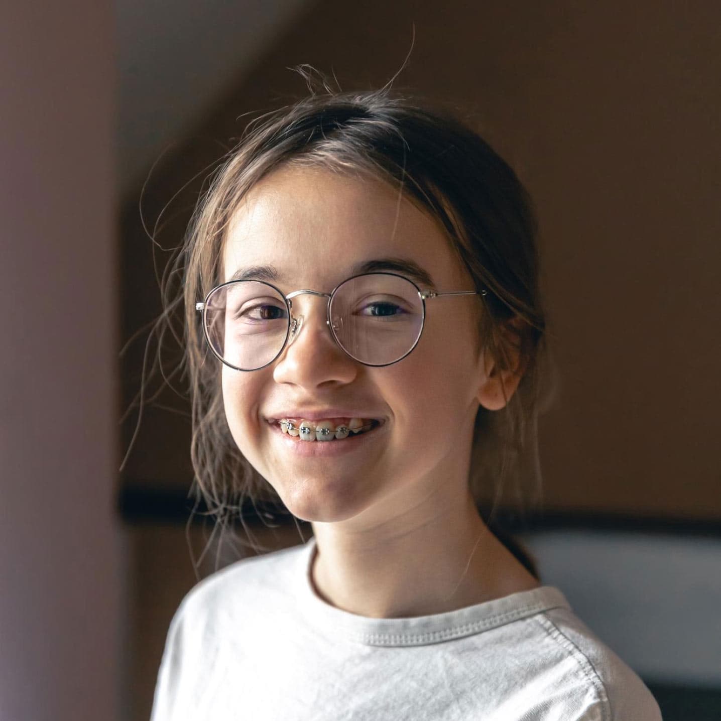 Girl with glasses and braces